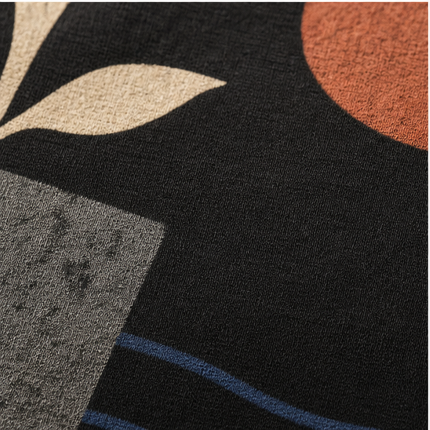 Close-up of Black G5000 cotton and matte botanical print