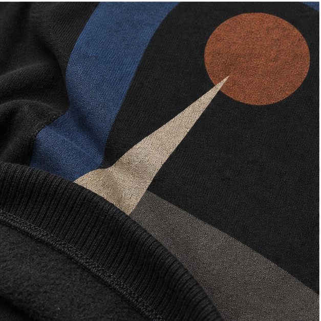 Close-up of Black Heavy Blend fleece and matte Night Arc print