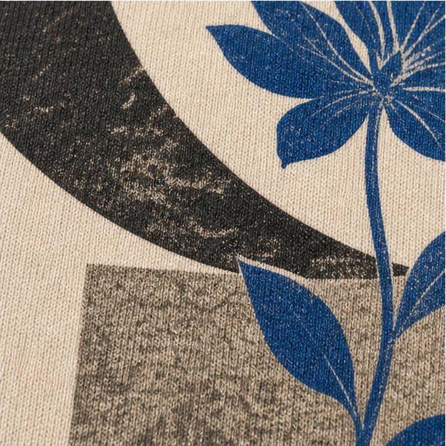 Close-up of Ivory cotton and matte Lunar Bloom artwork