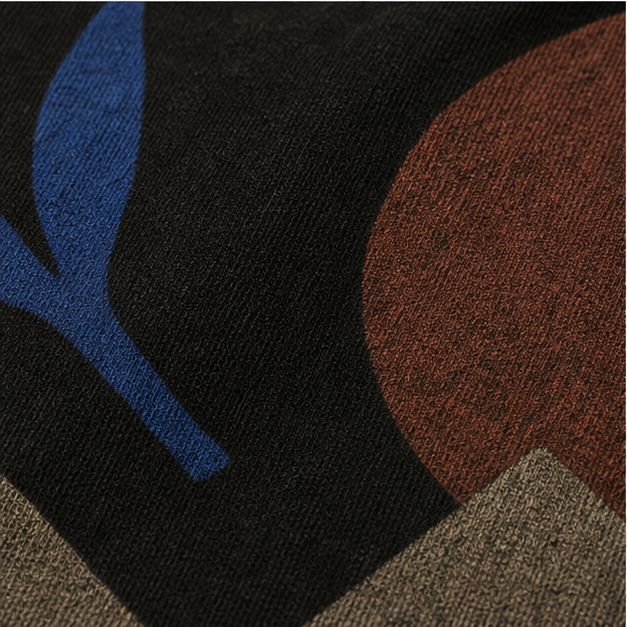 Close-up of Black garment-dyed cotton and matte Night Garden artwork