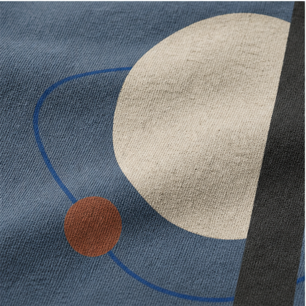 Close-up of Blue Jean cotton texture and matte Quiet Orbit artwork